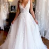 Ivory A-Line Deep V-Neck Backless Long Wedding Dress with Lace